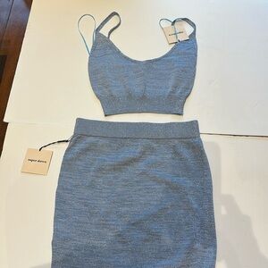 Super down 2 piece skirt set, size xs never worn shimmer light blue knit